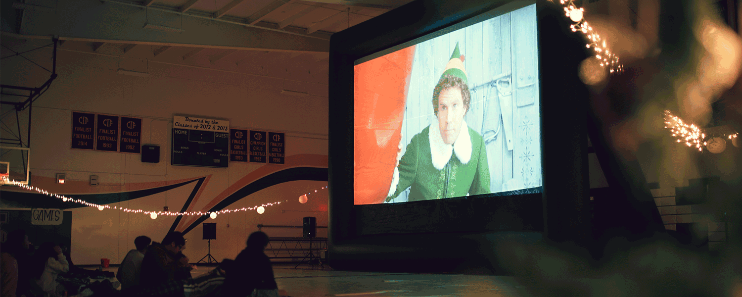 Inflatable screen indoors at a Christmas movie party