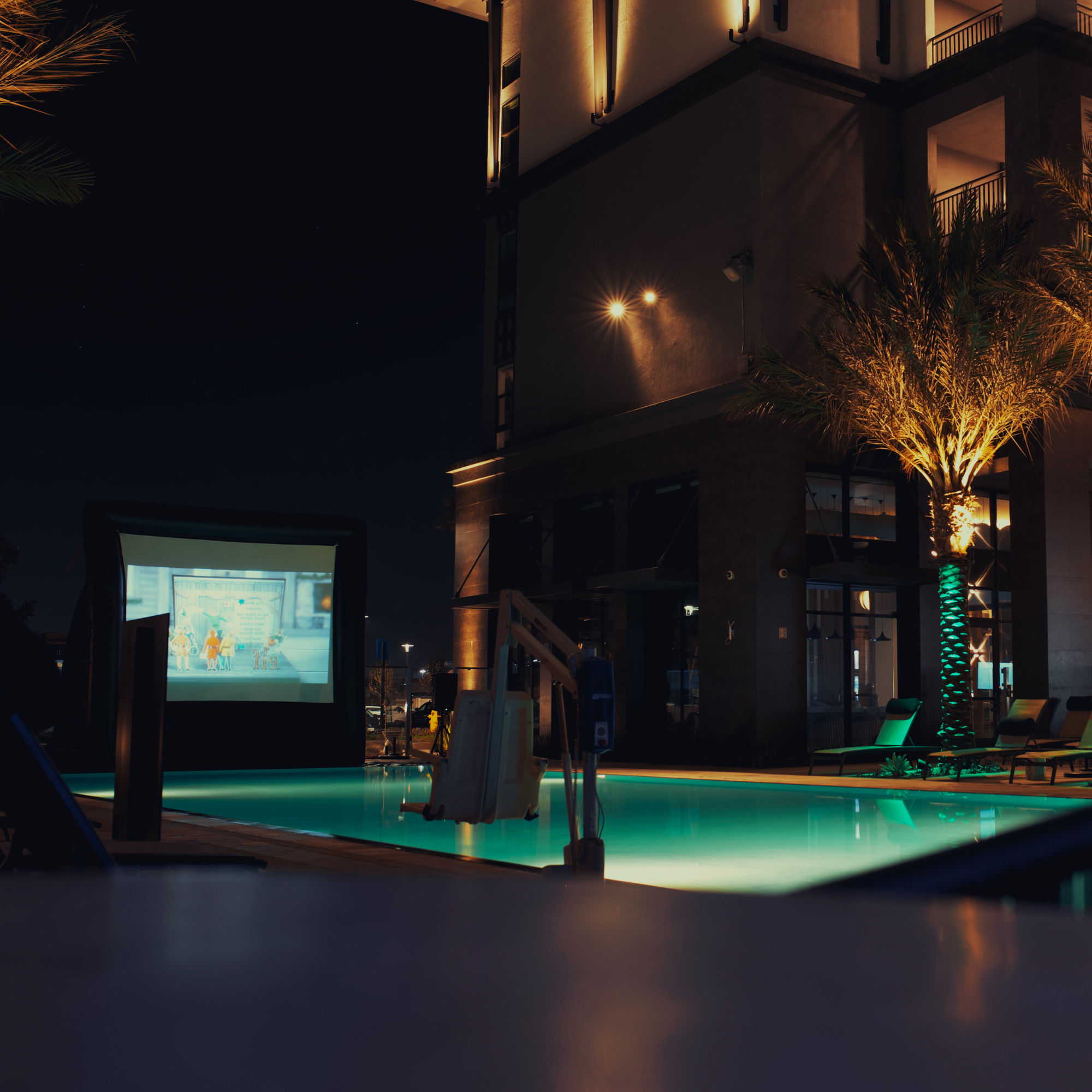 Apartment movie party by the pool