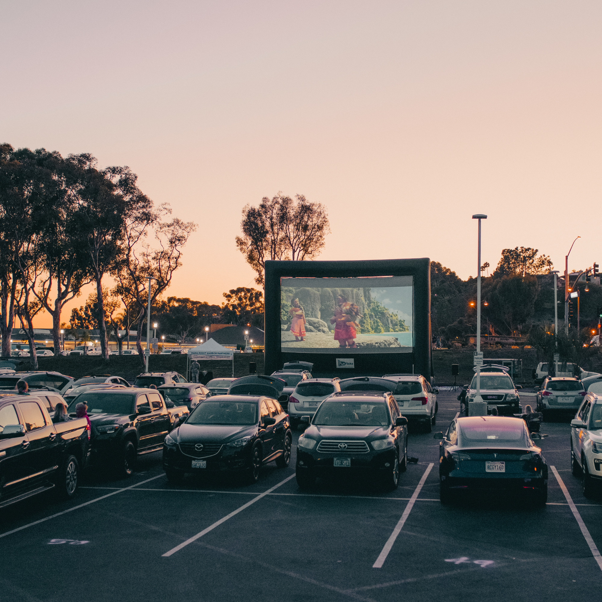 Huge FunFlicks® inflatable movie screen at a drive-in
