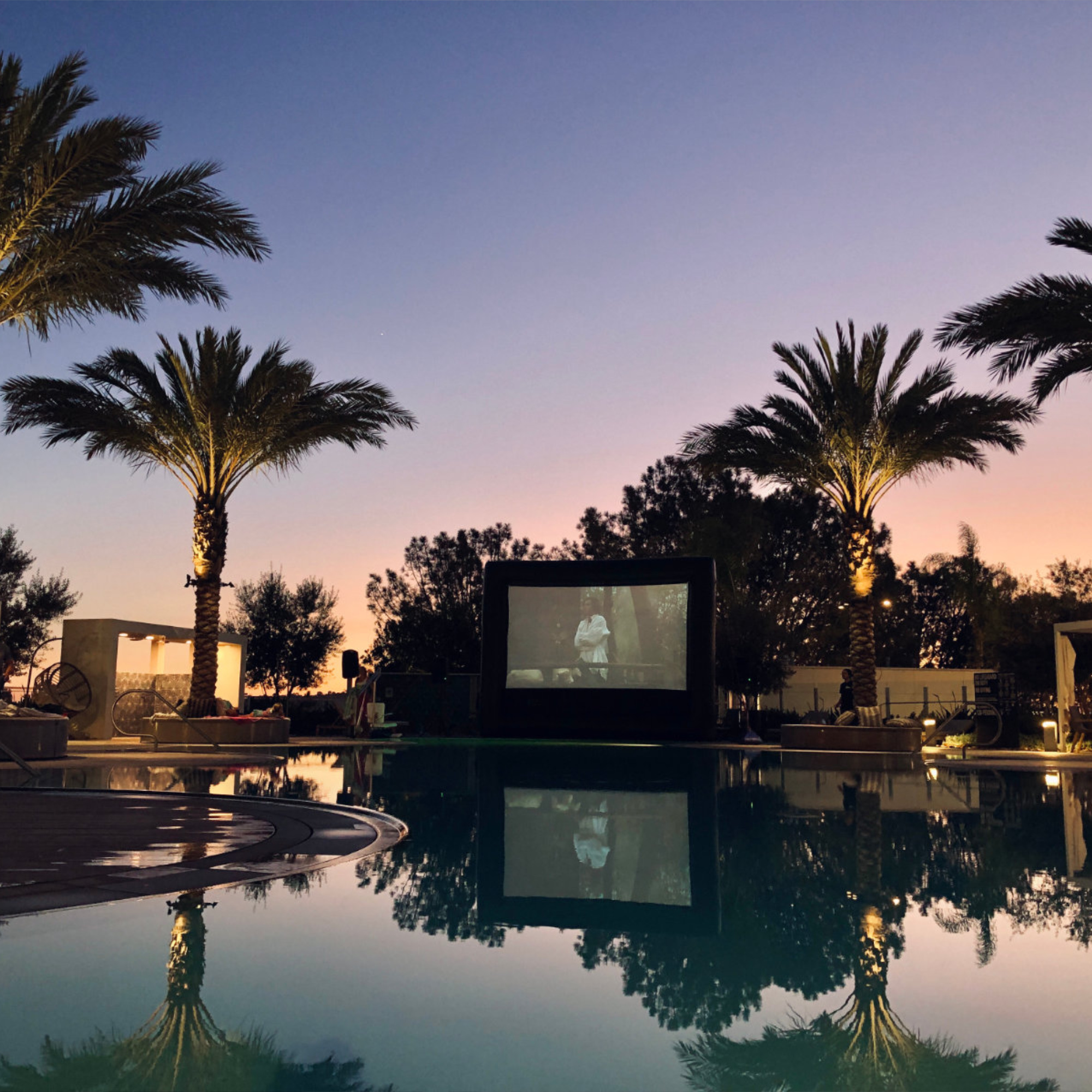 Inflatable movie screen by the pool