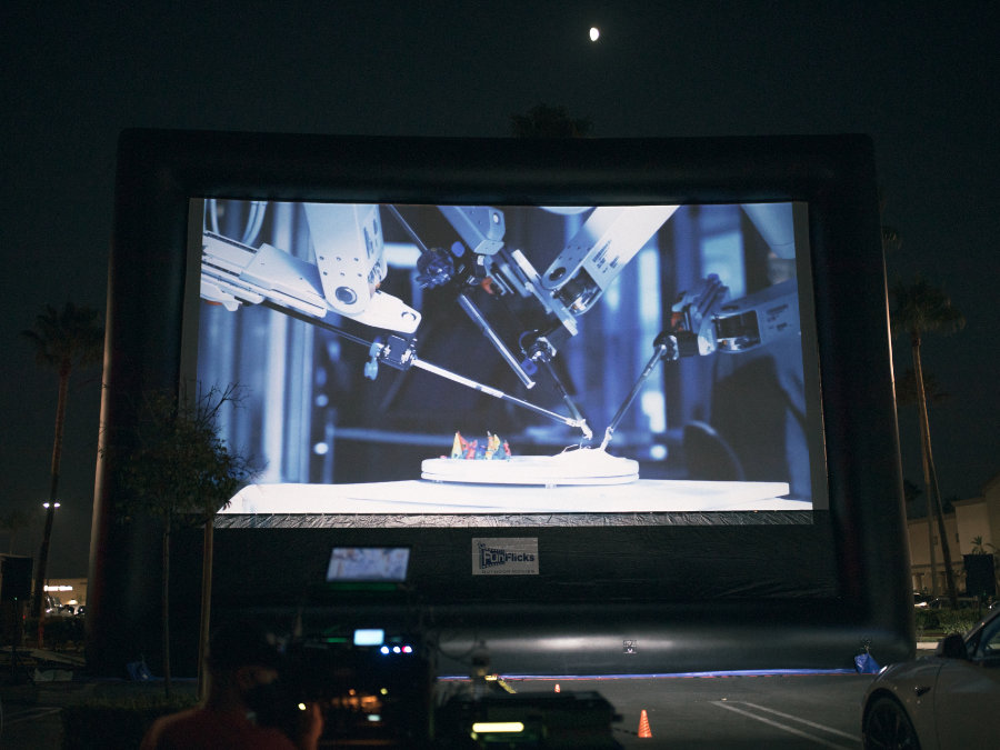 Corporate event watching documentary at the drive in