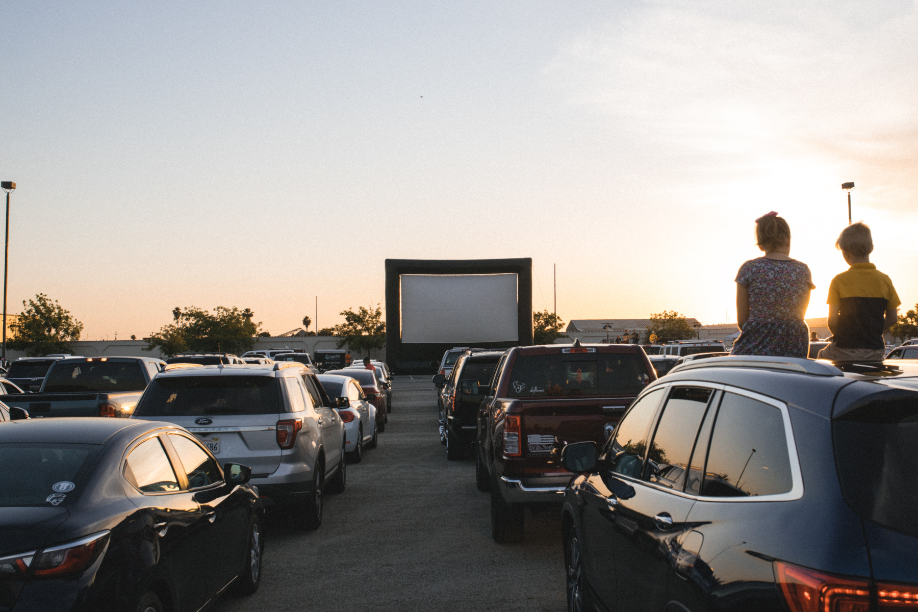 Kids at the Drive-In movie at sunset