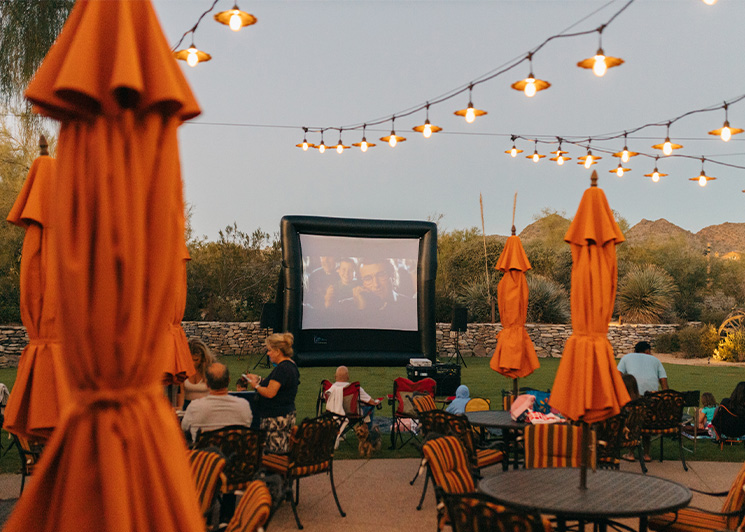 Baby showers party in a backyard with a FunFlicks inflatable screen