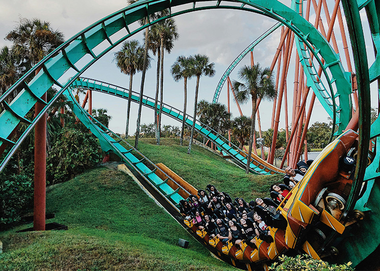 People enjoying a roller coaster ride