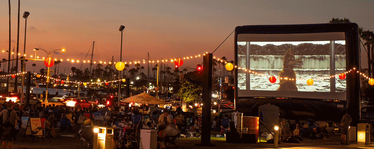 FunFlicks inflatable movie screen at a huge outdoor movie party