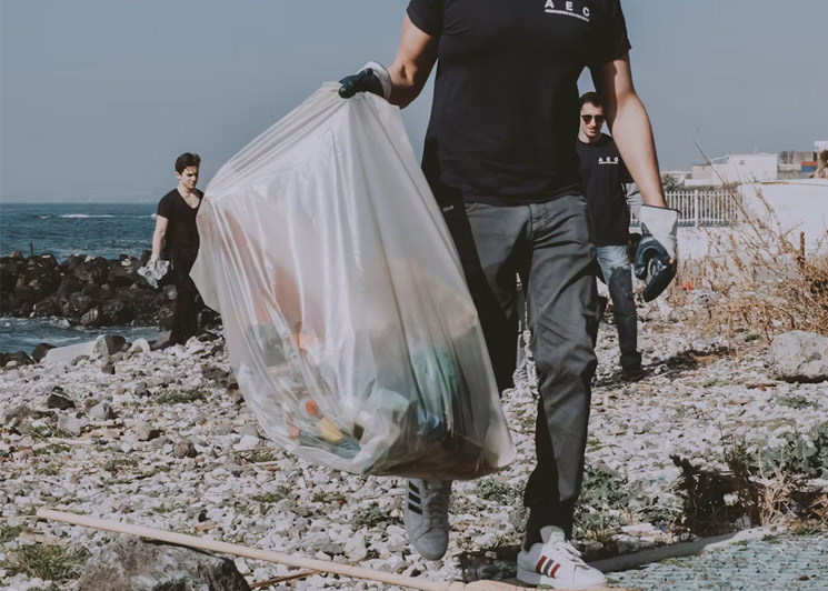 Group of volunteers picking up trash